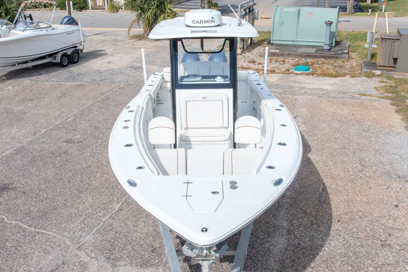 Slide: The Image of 2022 Sea Hunt Gamefish 27 boat with Garmin equipment, parked on a trailer. - 11