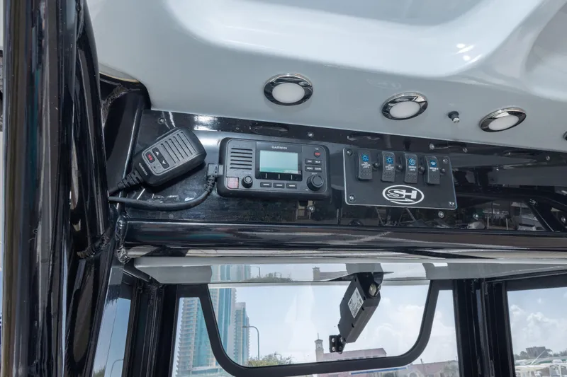Slide: The Image of Control panel of 2022 Sea Hunt Gamefish 27 boat with Garmin radio and switches. - 41