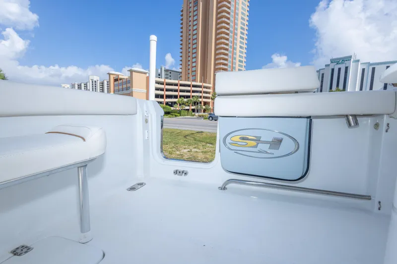 Slide: The Image of 2022 Sea Hunt Gamefish 27 interior with cityscape background, showcasing sleek design and comfort. - 40