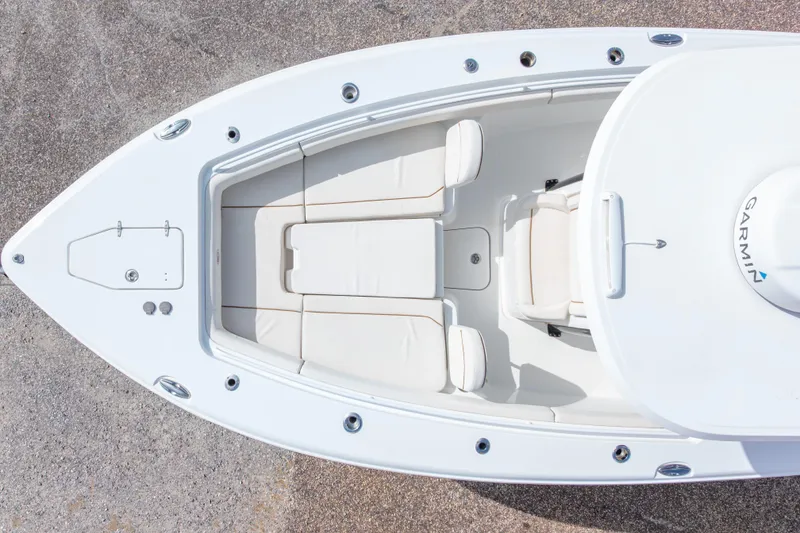Slide: The Image of Top view of 2022 Sea Hunt Gamefish 27 boat with white seating and Garmin equipment. - 46
