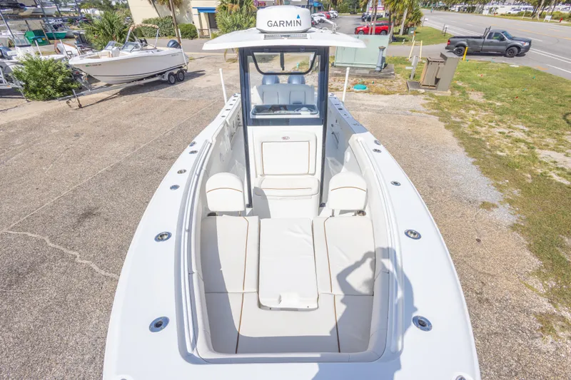 Slide: The Image of 2022 Sea Hunt Gamefish 27 boat with spacious seating and Garmin navigation system. - 28