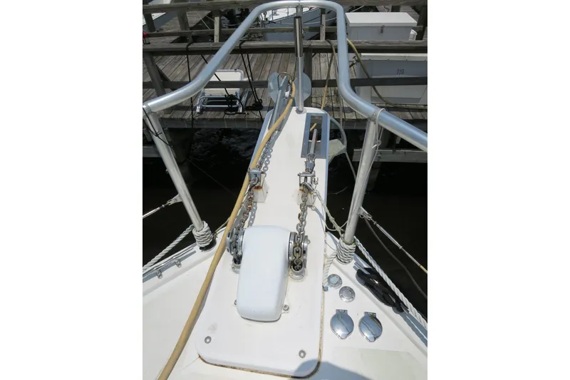 Slide: The Image of Bow of 2007 Grand Harbour N47 yacht with anchor chain and dock view. - 12