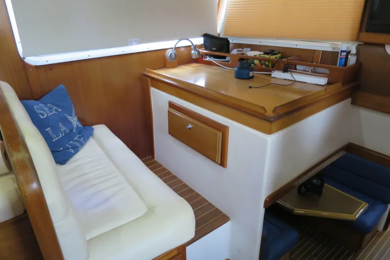 Slide: The Image of Interior of 2007 Grand Harbour N47 yacht with cozy seating and wooden accents. - 39