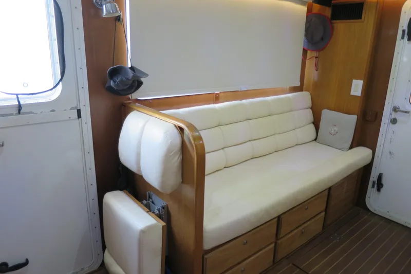 Slide: The Image of Interior of 2007 Grand Harbour N47 yacht with cream sofa and wooden accents. - 35