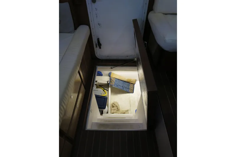 Slide: The Image of Engine room access on 2007 Grand Harbour N47 yacht, featuring storage and equipment. - 9