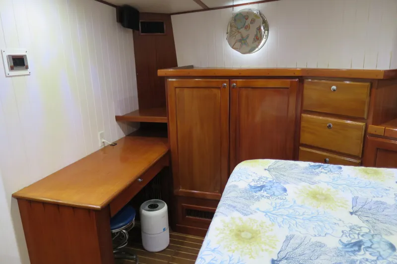 Slide: The Image of Cozy cabin interior of 2007 Grand Harbour N47 yacht with wooden furniture and nautical decor. - 20