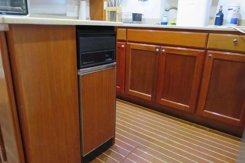 Slide: The Image of Wooden kitchen cabinetry in a 2007 Grand Harbour N47 yacht interior. - 34