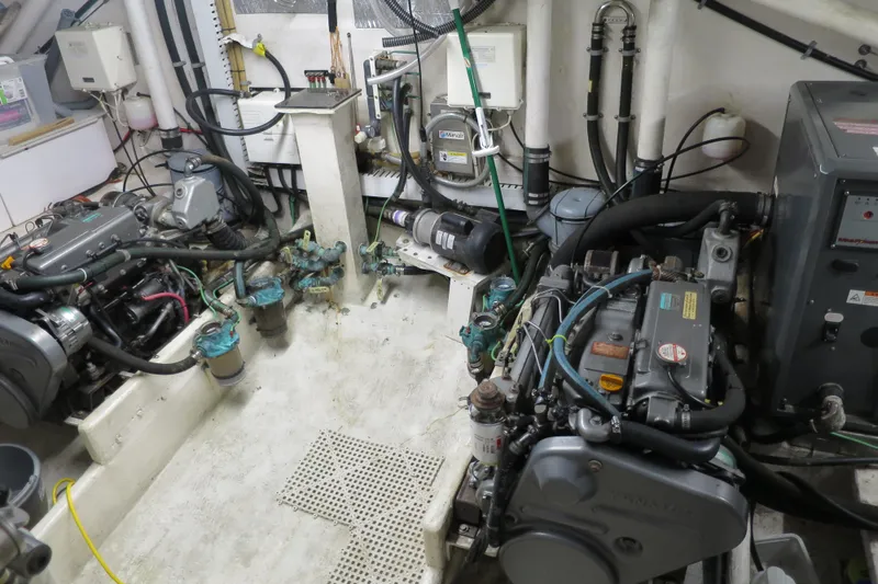 Slide: The Image of Engine room of a 2007 Grand Harbour N47 yacht, showcasing mechanical components. - 4