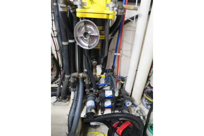 Slide: The Image of Engine room of 2007 Grand Harbour N47 yacht with complex piping and machinery. - 5
