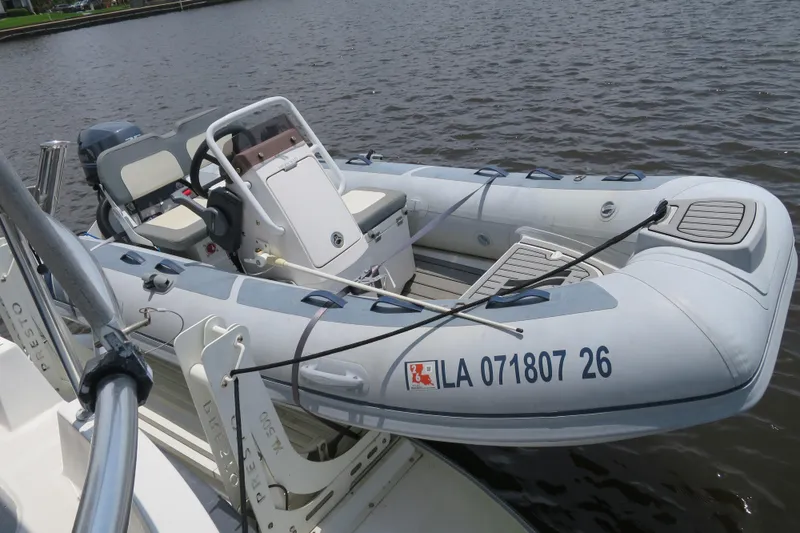 Slide: The Image of Inflatable boat docked on water, featuring a steering console and seating. - 10
