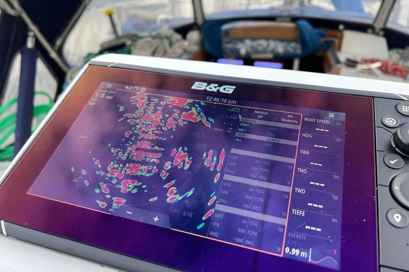 Slide: The Image of B&G marine navigation display on a 1980 Passport 40 sailboat, showing radar and speed data. - 34