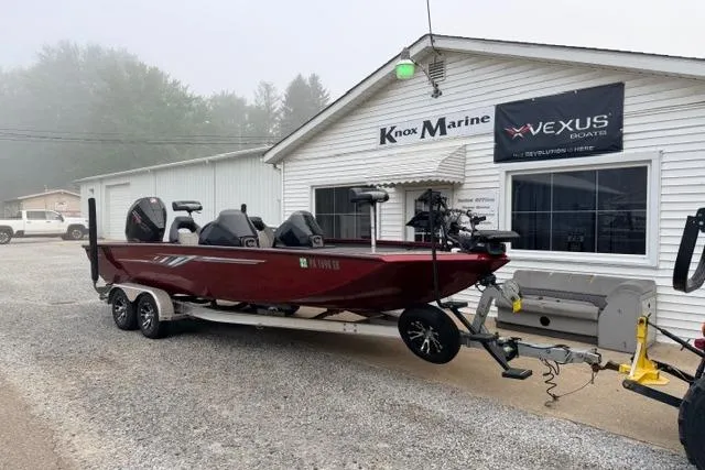 Slide: The Image of 2022 Crestliner MX 21 boat on trailer outside Knox Marine dealership. - 1