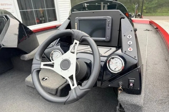 Slide: The Image of 2022 Crestliner MX 21 boat dashboard with steering wheel and control panel. - 5