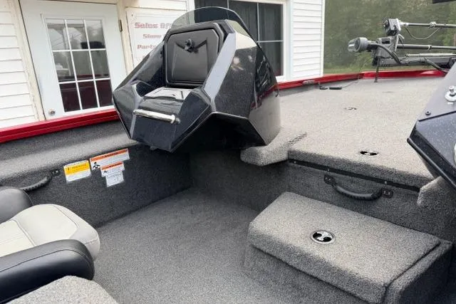 Slide: The Image of 2022 Crestliner MX 21 boat interior with seating and storage compartments. - 7