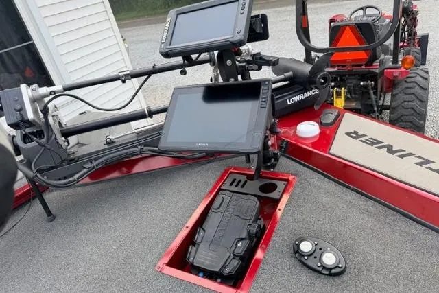 Slide: The Image of 2022 Crestliner MX 21 boat dashboard with Lowrance electronics and control panel. - 10