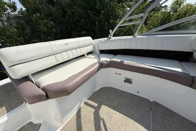 Slide: The Image of 2012 Cobalt 276 boat interior with cushioned seating and sleek design. - 6