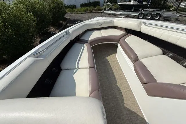 Slide: The Image of Spacious seating area on a 2012 Cobalt 276 boat with beige and brown upholstery. - 15