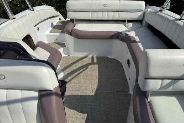 Slide: The Image of Interior of a 2012 Cobalt 276 boat with white and beige seating. - 31