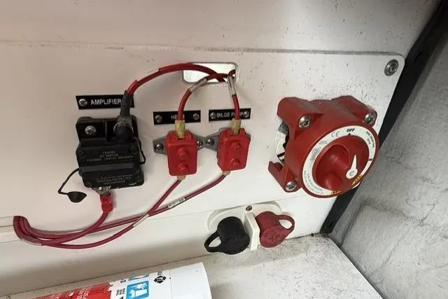 Slide: The Image of Electrical panel with switches and wiring in a 2012 Cobalt 276 boat. - 8