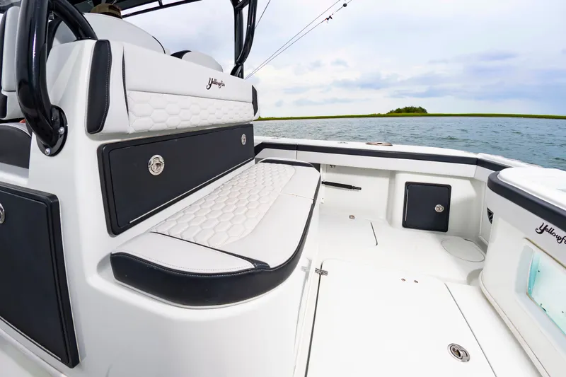 Slide: The Image of The image shows the cockpit of a 2025 Yellowfin 32 Offshore boat with sleek seating. - 19