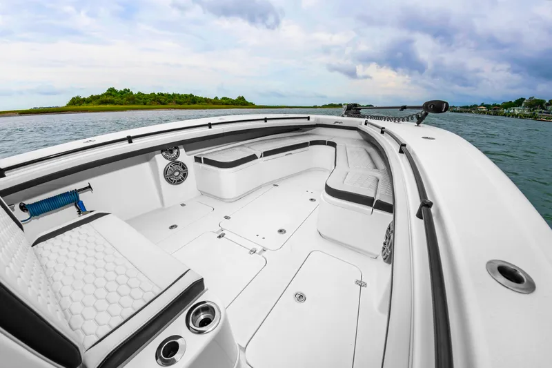 Slide: The Image of The image shows the spacious deck of a 2025 Yellowfin 32 Offshore boat on the water. - 29