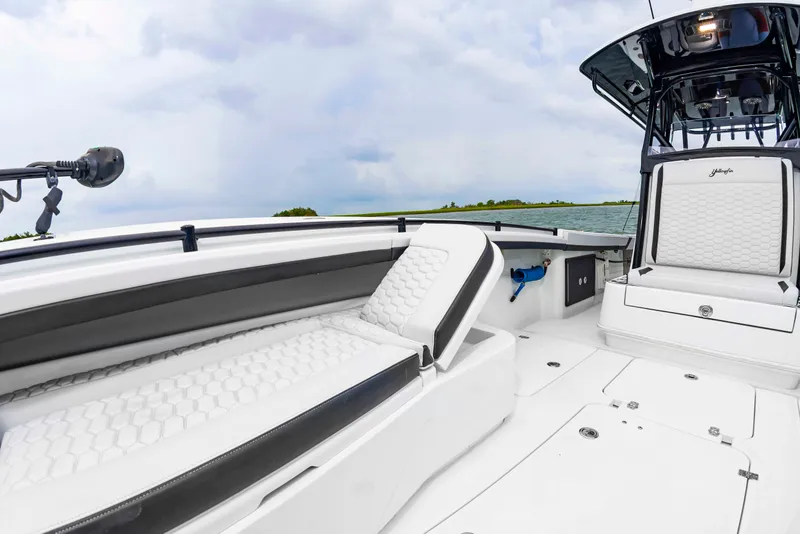 Slide: The Image of The image shows the deck of a 2025 Yellowfin 32 Offshore with white upholstery and modern design. - 35