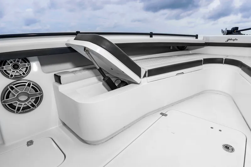 Slide: The Image of The image shows the deck of a 2025 Yellowfin 32 Offshore with seating and speakers. - 34