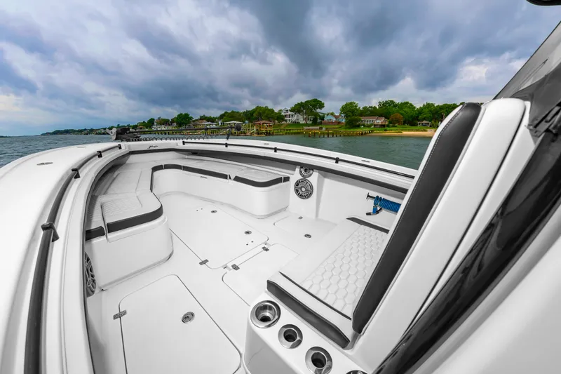 Slide: The Image of The image shows the spacious deck of a 2025 Yellowfin 32 Offshore boat with white upholstery. - 30