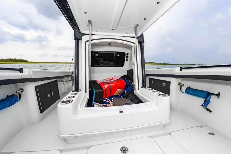 Slide: The Image of The image shows the cockpit of a Yellowfin 32 Offshore boat with storage and equipment. - 33