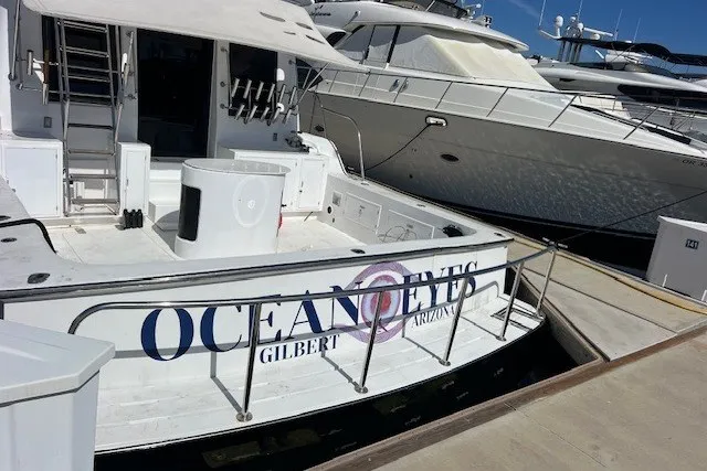Slide: The Image of Mikelson 64 yacht named "Ocean Eyes" docked at marina, 1994 model. - 1