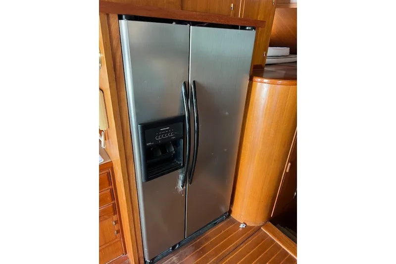 Slide: The Image of Stainless steel refrigerator in a 1994 Mikelson 64 yacht interior. - 50