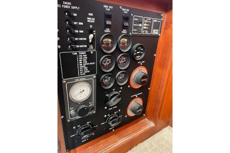 Slide: The Image of Control panel of a 1994 Mikelson 64 yacht with gauges and switches. - 43