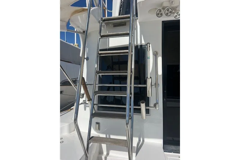 Slide: The Image of Stainless steel ladder on a 1994 Mikelson 64 yacht, leading to upper deck. - 68