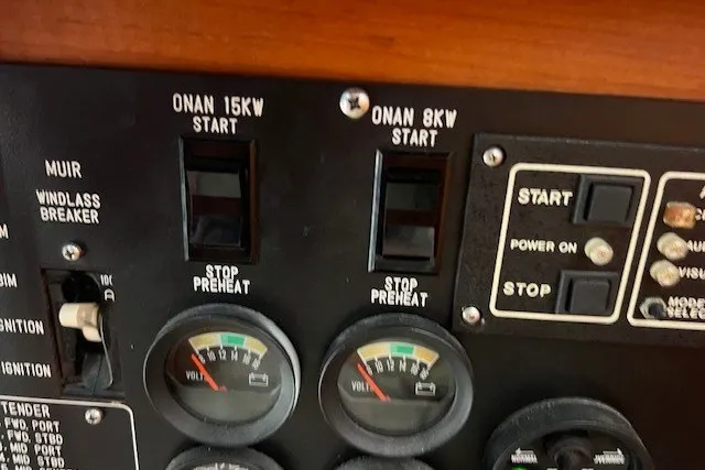 Slide: The Image of Control panel of a 1994 Mikelson 64 yacht with Onan generator switches and voltmeters. - 58
