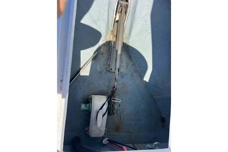 Slide: The Image of Anchor compartment of a 1994 Mikelson 64 yacht, showing chain and winch mechanism. - 39