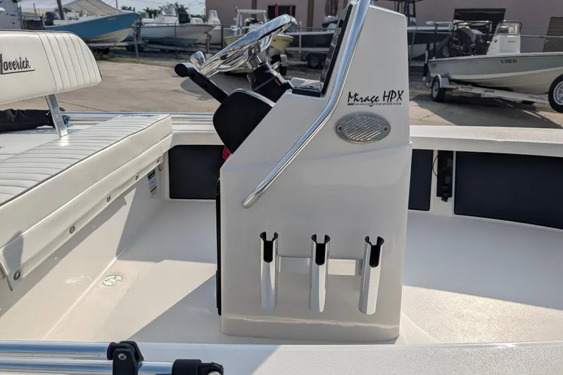 Slide: The Image of 2021 Maverick 18 HPX-V boat interior with steering console and seating. - 11