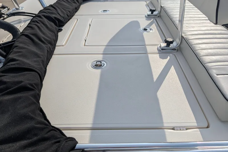 Slide: The Image of 2021 Maverick 18 HPX-V boat deck with storage compartments and seating. - 22