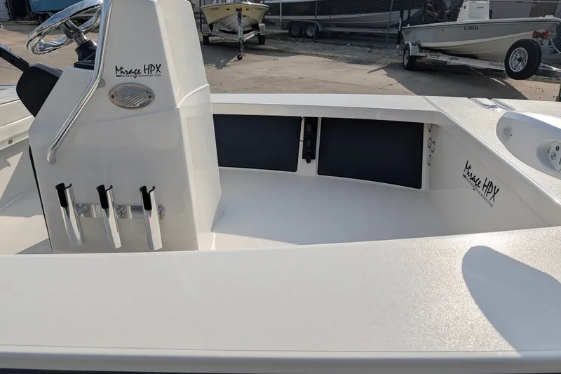 Slide: The Image of 2021 Maverick 18 HPX-V boat interior with steering console and rod holders. - 10