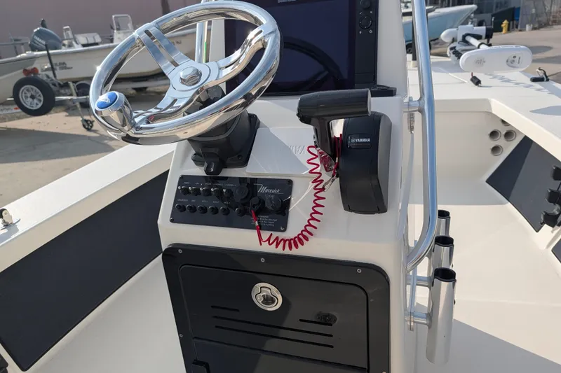 Slide: The Image of 2021 Maverick 18 HPX-V boat console with steering wheel and Yamaha controls. - 15