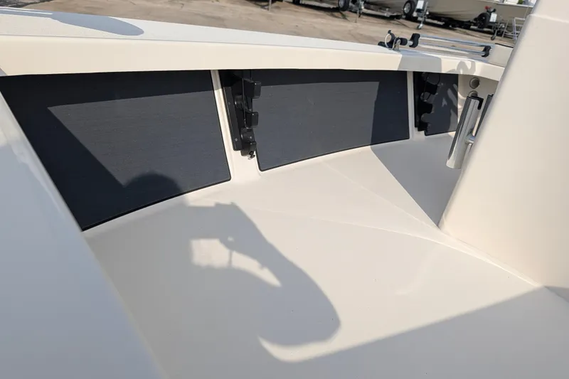 Slide: The Image of Interior view of a 2021 Maverick 18 HPX-V boat, showcasing storage compartments. - 16
