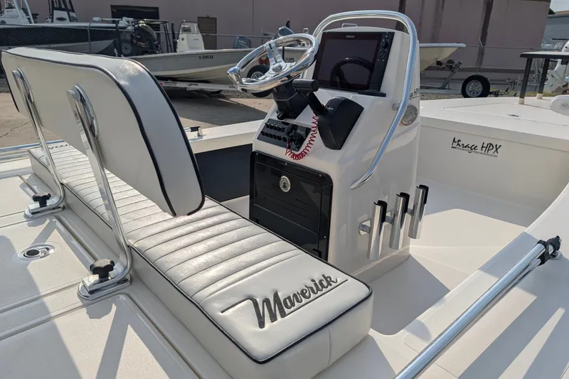 Slide: The Image of 2021 Maverick 18 HPX-V boat interior with steering console and cushioned seating. - 12