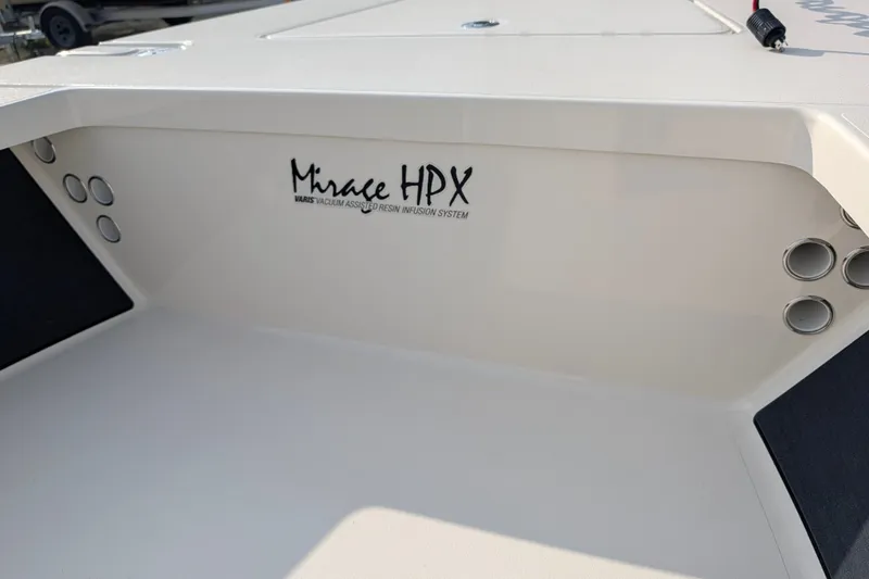 Slide: The Image of 2021 Maverick 18 HPX-V boat interior with Mirage HPX VARIS logo. - 18