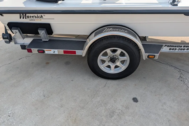 Slide: The Image of Trailer of 2021 Maverick 18 HPX-V boat with visible tire and branding. - 9