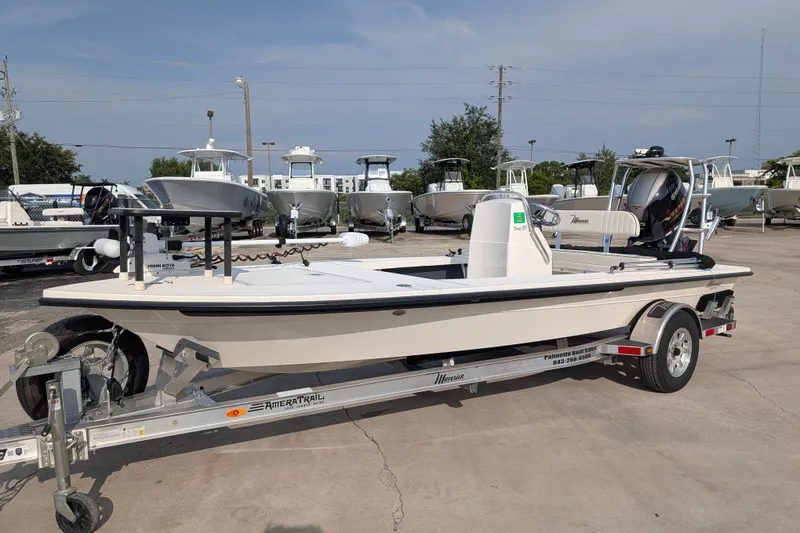 The Image of 2021 Maverick 18 HPX-V boat on trailer, displayed in a dealership lot. - 1