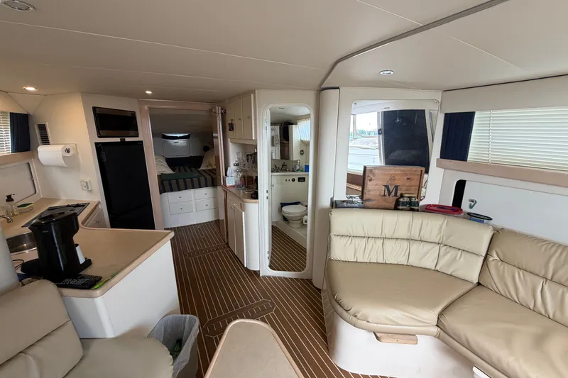 Slide: The Image of Interior of a 1999 Carver 380 Santego yacht with cozy seating and modern amenities. - 36