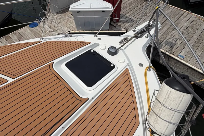 Slide: The Image of Deck of 1999 Carver 380 Santego yacht with wood finish and docked at marina. - 28