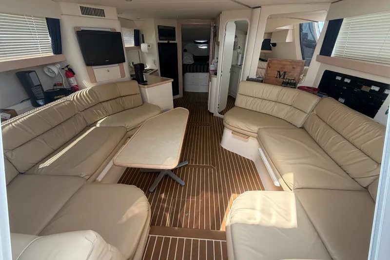 Slide: The Image of Luxurious interior of a 1999 Carver 380 Santego yacht with beige leather seating. - 32