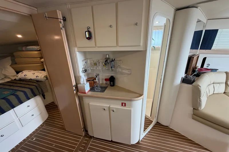 Slide: The Image of Interior of 1999 Carver 380 Santego yacht with kitchenette and cozy seating area. - 41