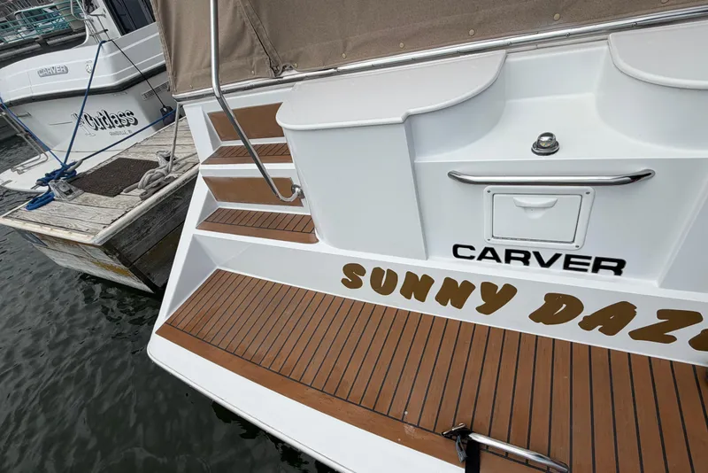 Slide: The Image of 1999 Carver 380 Santego yacht named "Sunny Daze" docked at marina. - 11
