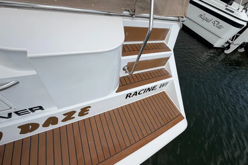 Slide: The Image of 1999 Carver 380 Santego boat with wooden steps, docked in Racine, WI. - 10